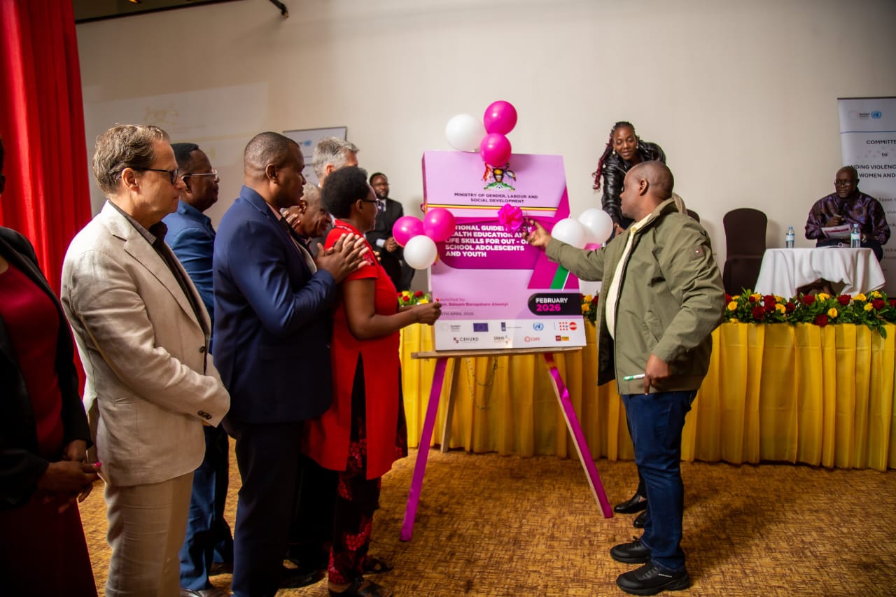 The State Minister for Gender, Labour and Social Development in charge of Children and Youth Affairs, Balaam Barugahara Ateenyi, launches the guidelines.