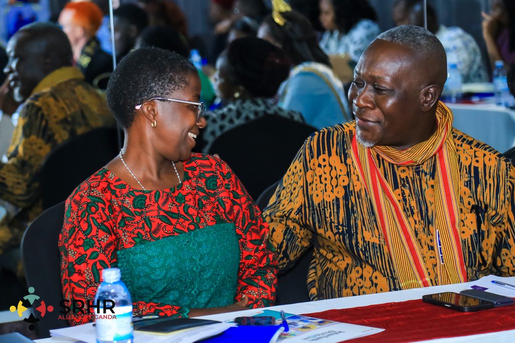 Dr. Viola Nyakato and Mr. Mondo Kyateka share a light moment during the interfaith dialogue