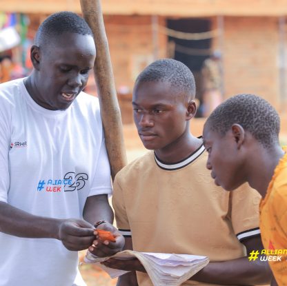 Okwang Sani Jerry During a community out reach