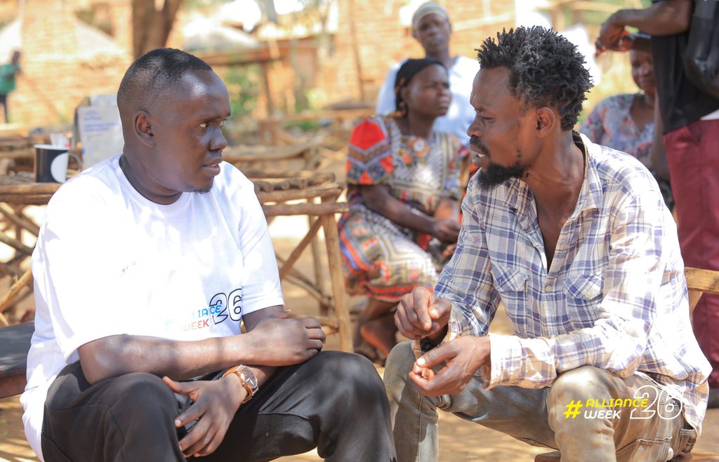 Sani Jerry engages a community member in a one-on-one discussion during Alliance Week.